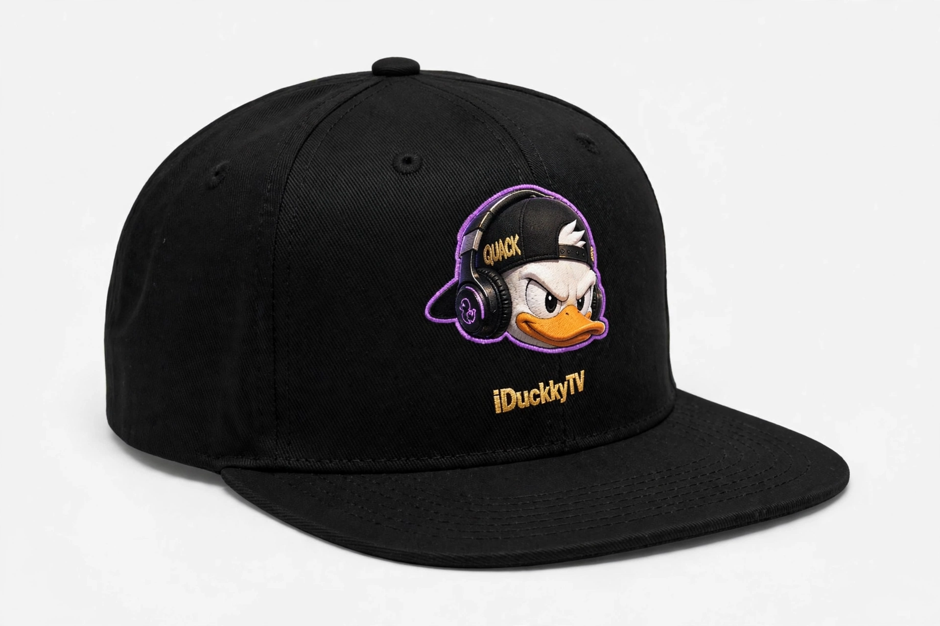 Black flat-brim snapback with an embroidered duck head patch and iDuckkyTV stitched in gold